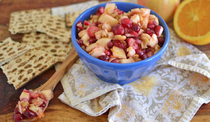 Apple and cranberry Passover charoset is tart and fruity, mixed with pomegranate seeds and a touch of honey for sweetness.