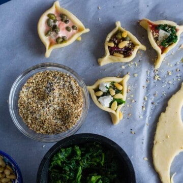 Savory hamantaaschen with six different 'around the world' fillings, including a pizza hamantaschen and so much more!
