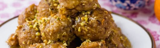 Baklava Bimuelos: Sephardic Passover Matzo Donuts Fried and Doused in a Thick Rose Water Syrup with Pistachios.