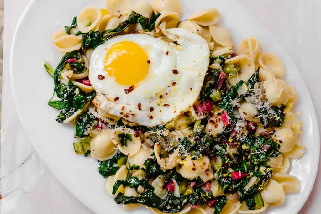 A simple chard pasta recipe, Orecchiette with Swiss Chard, Parmesan and fresh Lemon is light and quick to make for a weeknight dinner. #swisschard #pastarecipe