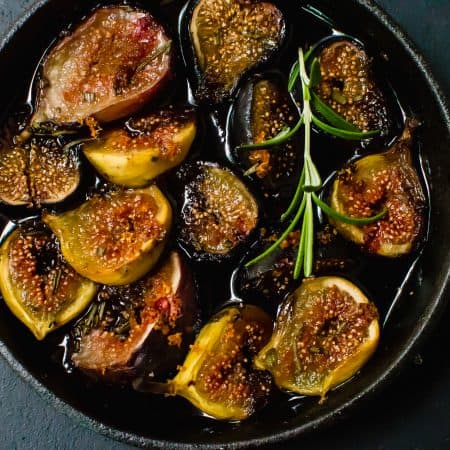 Red Wine Roasted Figs with Honey and Rosemary is the perfect accompaniment for your cheese board or spoon over ricotta or Greek yogurt.