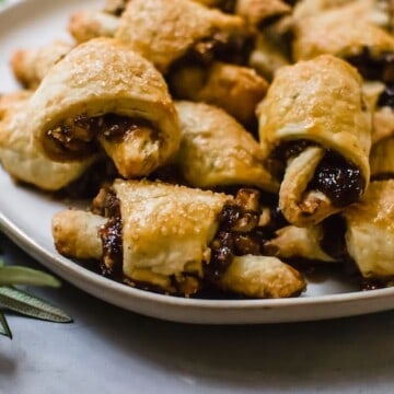 Rosemary and Fig Rugelach is a play on the traditional Jewish cookie, with sweet fig jam, caramelized walnuts and a touch of fresh rosemary for a sweet and slightly savory bite.