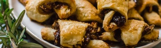 Rosemary and Fig Rugelach is a play on the traditional Jewish cookie, with sweet fig jam, caramelized walnuts and a touch of fresh rosemary for a sweet and slightly savory bite.