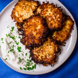 A play on the traditional potato latkes, these salt and vinegar potato latkes have a hint of sourness from the vinegar and a healthy sprinkle of sea salt. Serve along side onion and chive sour cream for a fun play on latkes.