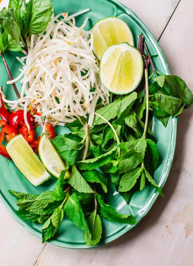 Garnish chicken pho with bean sprouts, fresh mint, basil and cilantro.