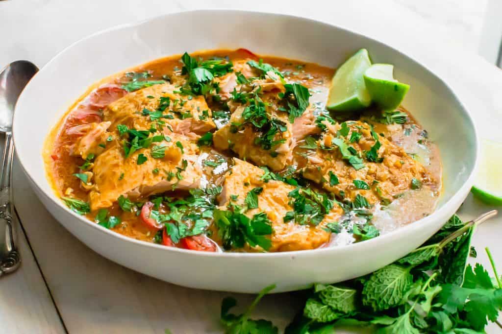 A simple salmon curry with with strong Thai flavors of ginger, galangal and lemongrass. Serve with basmati rice for a flavorful and quick weeknight dinner.