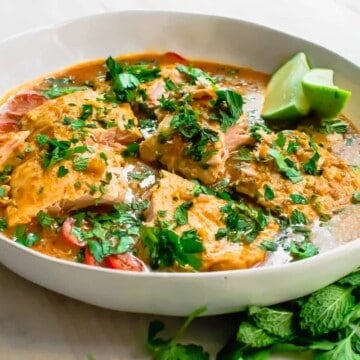 A simple salmon curry with with strong Thai flavors of ginger, galangal and lemongrass. Serve with basmati rice for a flavorful and quick weeknight dinner.