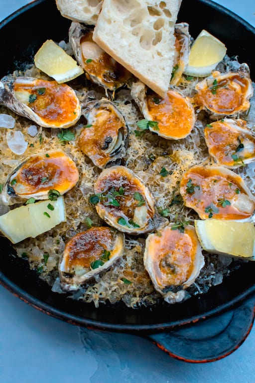 Inspired by a New Orleans favorite, these charbroiled oysters are cooked with paprika herb butter and topped with Parmesan cheese and lemon. 