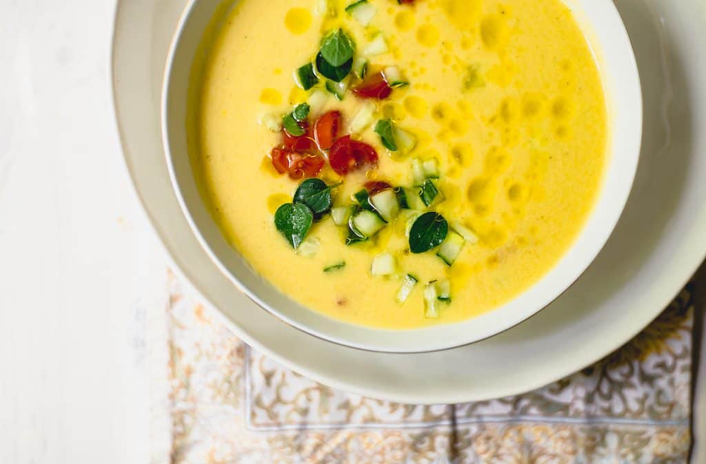 Yellow tomato gazpacho soup is the epitome of summer. This chilled soup is ice cold, silky smooth and bright yellow with a small kick.