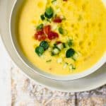 Yellow tomato gazpacho soup is the epitome of summer. This chilled soup is ice cold, silky smooth and bright yellow with a small kick.