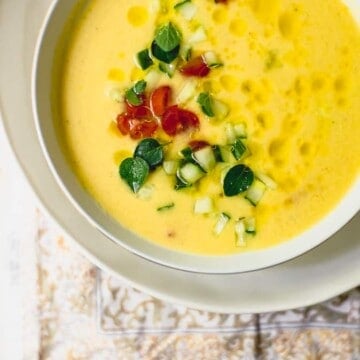 Yellow tomato gazpacho soup is the epitome of summer. This chilled soup is ice cold, silky smooth and bright yellow with a small kick.