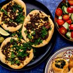 Inspired by the savory Lebanese meat pies called sfeeha, these open faced pies are topped with spiced beef or lamb and garnished with lemon and fresh herbs.