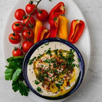 This easy and creamy tahini sauce is mixed with garlic, fresh lemon juice and spices that is the perfect addition to drizzle over grilled meats and vegetables.