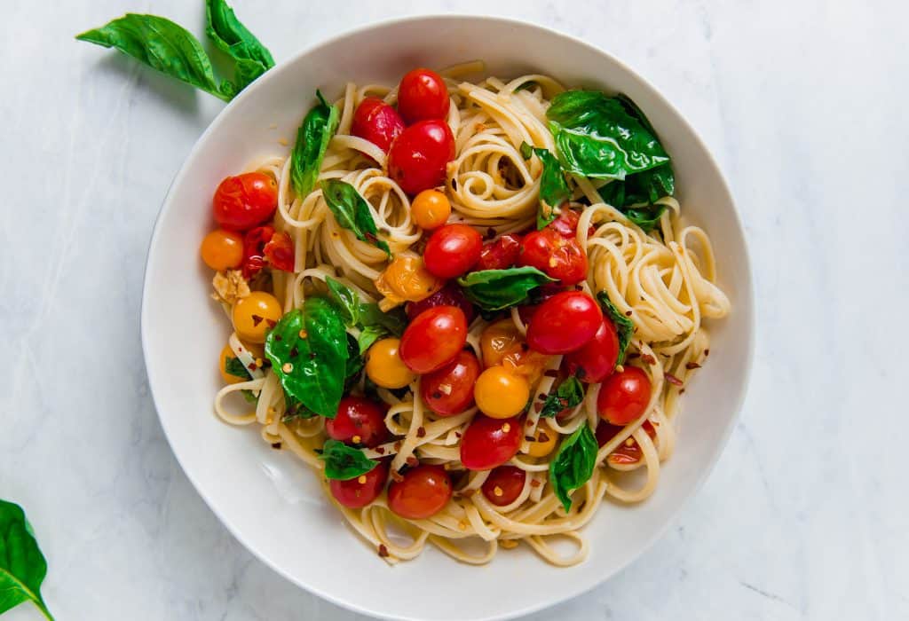 15 minute cherry tomato pasta is what summer dinners are made for! Sweet cherry tomatoes burst in olive oil and lots of garlic, creating the most delicious, slightly sweet and bright summery pasta. 