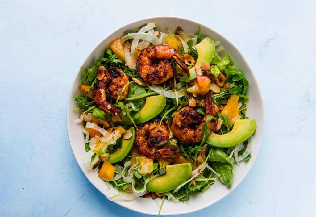 Grilled shrimp salad is fresh and hearty and full of spicy arugula, creamy avocado, thinly sliced fennel all dressed in a citrus vinaigrette.