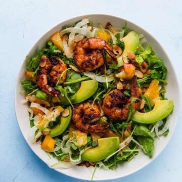 Grilled shrimp salad is fresh and hearty and full of spicy arugula, creamy avocado, thinly sliced fennel all dressed in a citrus vinaigrette.