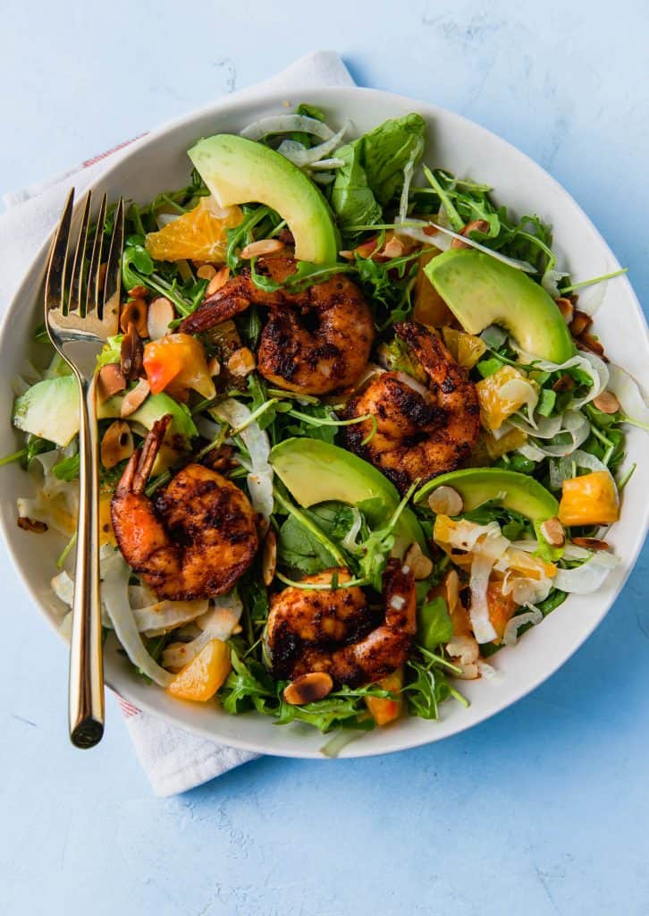 Grilled shrimp salad is fresh and hearty and full of spicy arugula, creamy avocado, thinly sliced fennel all dressed in a citrus vinaigrette.