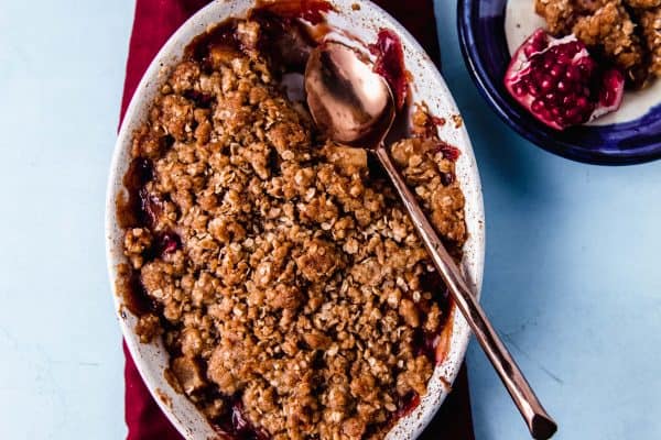 Pear and pomegranate crumble flavored with orange zest and vanilla paste is a simple and impressive weeknight dessert.