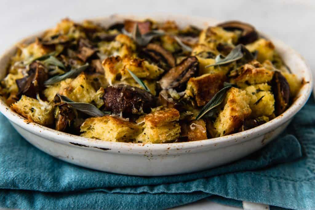 A modern spin on traditional stuffing, this savory bread pudding is filled with bold flavors of sauteed leeks, herb sauteed mushrooms and a good amount of nutty and savory Gruyere.