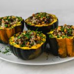 Acorn squash is stuffed with a Lebanese rice mixture called hashweh that is layered with warm spices of cinnamon, ground beef and tart cranberries.