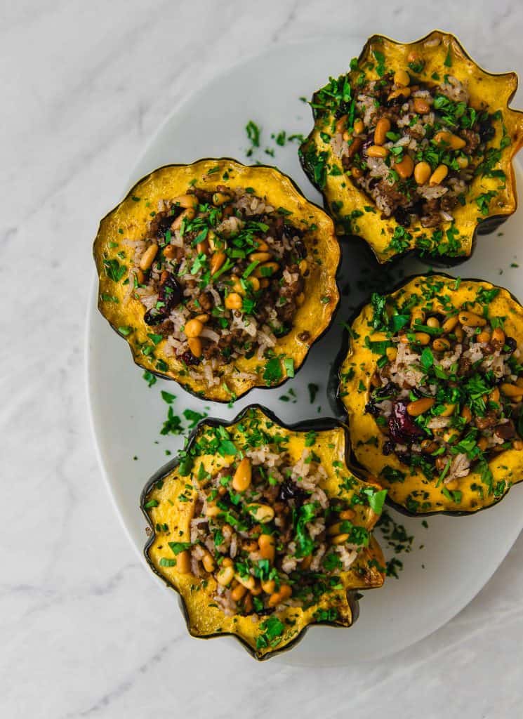 Acorn squash is stuffed with a Lebanese rice mixture called hashweh that is layered with warm spices of cinnamon, ground beef and tart cranberries. 