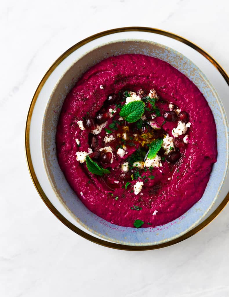 This will be your new favorite hummus! Sweet roasted beets and smoky cumin are added to homemade hummus creating the most stunning, vibrant and delicious creamy hummus. 