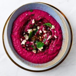 This will be your new favorite hummus! Sweet roasted beets and smoky cumin are added to homemade hummus creating the most stunning, vibrant and delicious creamy hummus.