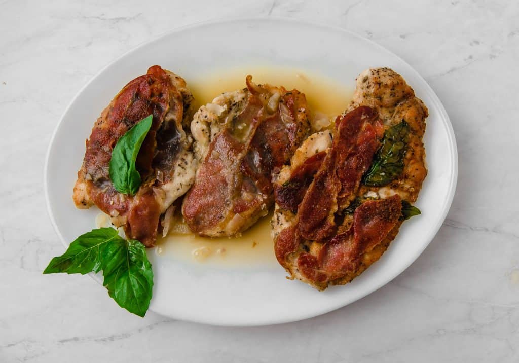 A twist on the popular Italian dish, this version of chicken saltimbocca has pounded chicken cutlets with aromatic herbes de Provence, smoky speck and fresh basil that is finished in a light white wine sauce.