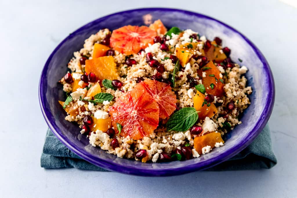 A colorful winter quinoa salad with roasted yellow beets, tangy blood orange, salty feta cheese and sweet pomegranate seeds all dressed with a simple blood orange vinaigrette.