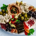 Learn to make a colorful and flavorful vegetarian mezze platter with all the Mediterranean favorites, including stuffed grape leaves, hummus and fresh fruit and vegetables.
