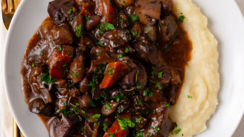 Julia Child French beef bourguignon recipe with mushrooms and red wine.
