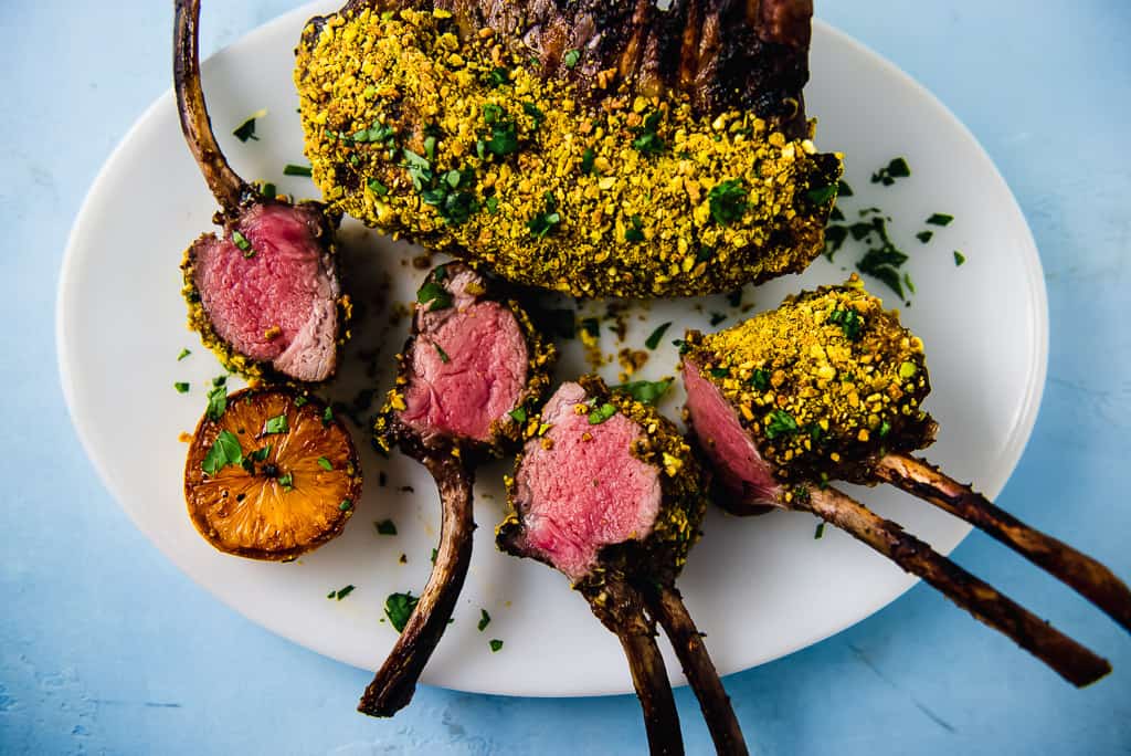Pistachio crusted rack of lamb is a recipe to impress! Once seared, the lamb is brushed with tangy Dijon mustard and then pressed onto crushed pistachios.