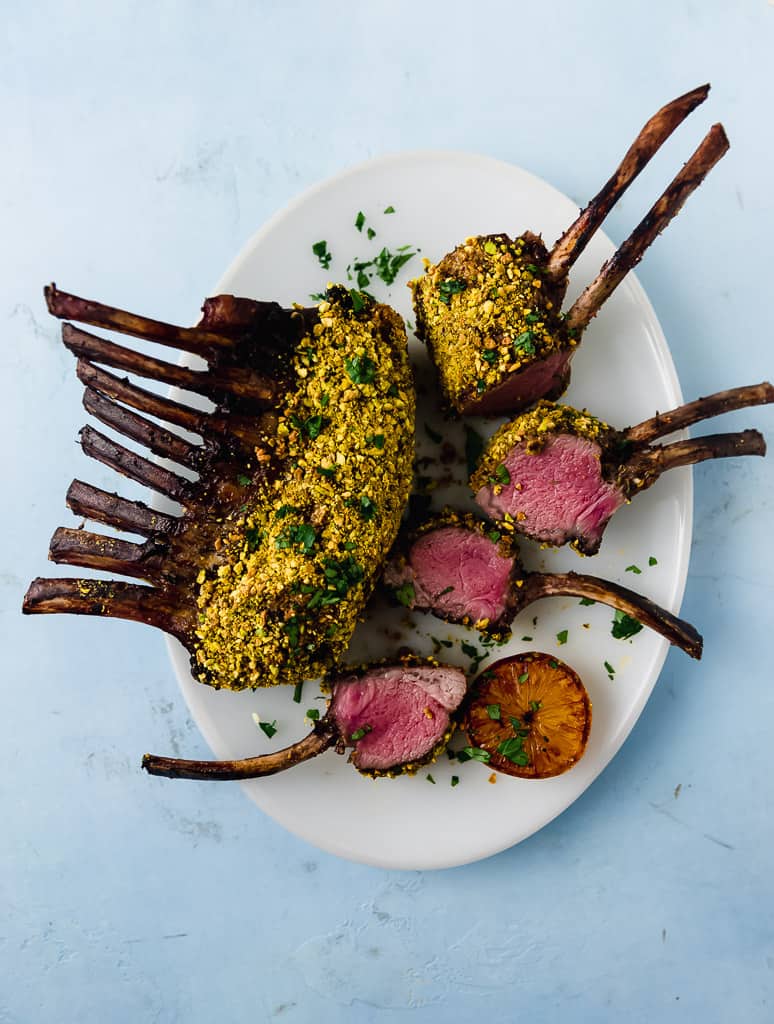 Pistachio crusted rack of lamb is a recipe to impress! Once seared, the lamb is brushed with tangy Dijon mustard and then pressed onto crushed pistachios. 