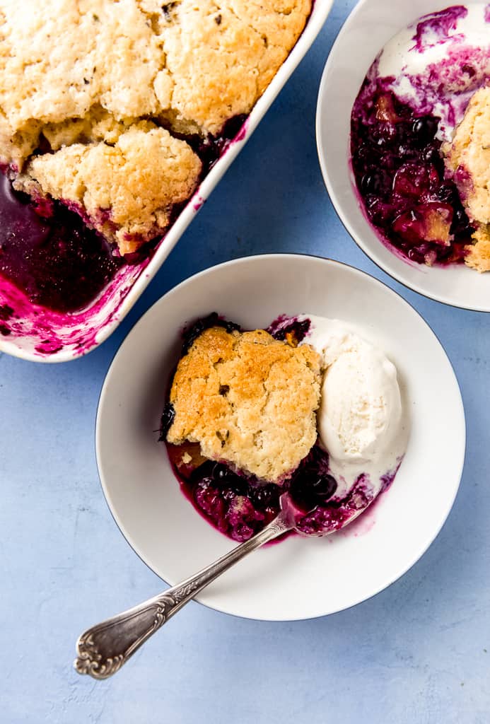 A classic recipe for blueberry peach cobbler with just enough floral lavender to make the sweet dessert pop. This is what summer desserts are made for!