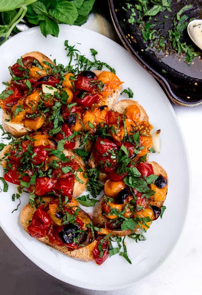 When tomatoes are at their peak, roasted tomato bruschetta is on the menu! Served over crostini, fresh basil and fruity olive oil.