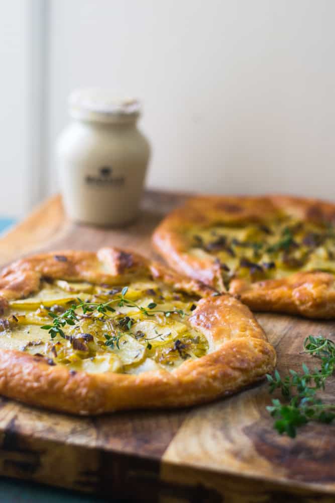 Potato leek tart is an impressive savory tart inspired from the famous potato leek soup, vichyssoise. The savory tart boasts big bold flavors and is layered with a Dijon bechamel, savory leeks and bright fresh thyme. 