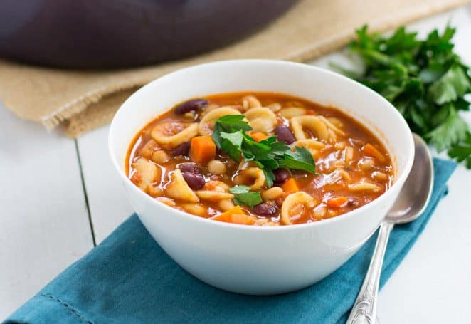 An easy and hearty one-pot soup, vegetarian pasta fagioli is full of two kinds of beans, pasta, sweet tomatoes and fresh herbes.