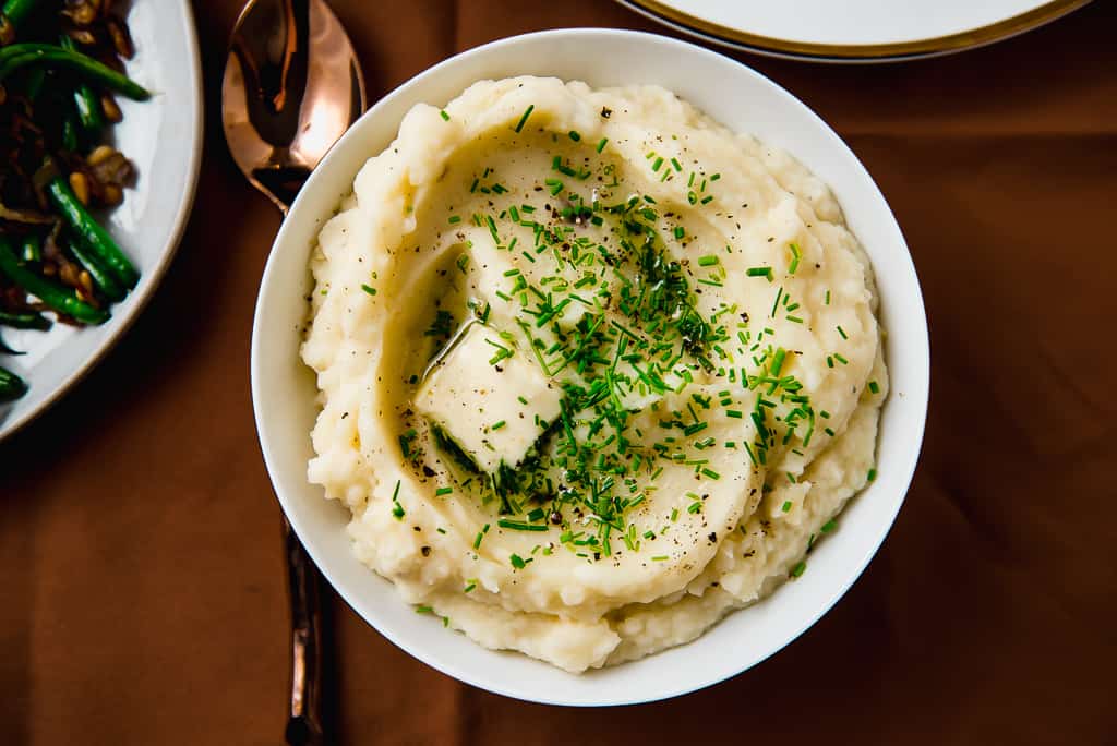 Creme fraiche mashed potatoes are mixed with sweet roasted garlic and finished with fresh chives and maybe an extra dab of butter too. 
