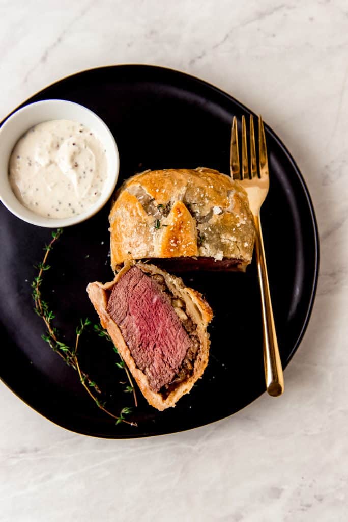 Individual beef wellington is the epitome of a classic, gourmet dish. Small filet mignon steaks are layered in puff pastry with a mushroom chestnut duxelle and a thin layer of paté. The individual beef wellingtons are perfect for a holiday dinner or for a special night in.