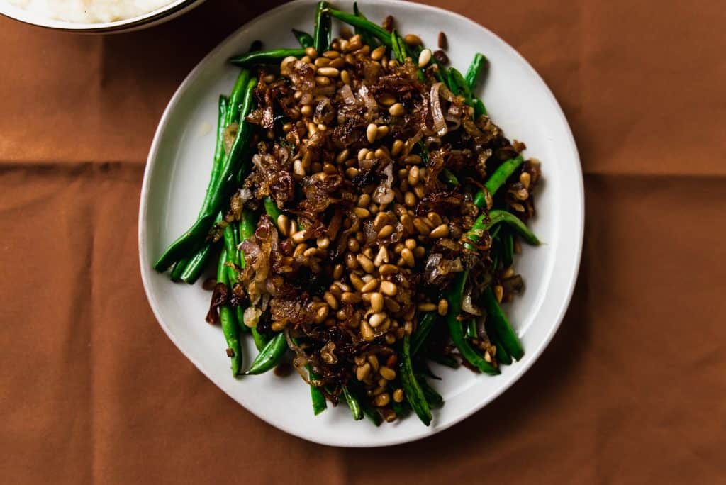Simply sauteed green beans are dressed up with fried shallots and toasted pine nuts. And the best part, all made in one pan! 