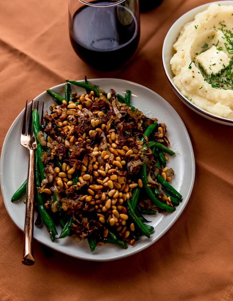 Simply sauteed green beans are dressed up with fried shallots and toasted pine nuts. And the best part, all made in one pan! 