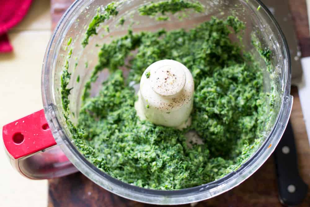 In a food processor, pulse frozen spinach, cheese, artichoke hearts and lemon zest to form a paste.