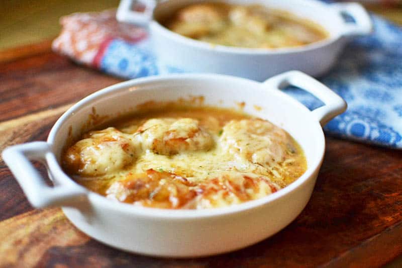 Julia Child's scallops gratineed is an elegant dish of gratineed scallops with shallots, white wine and broiled Gruyere cheese. 