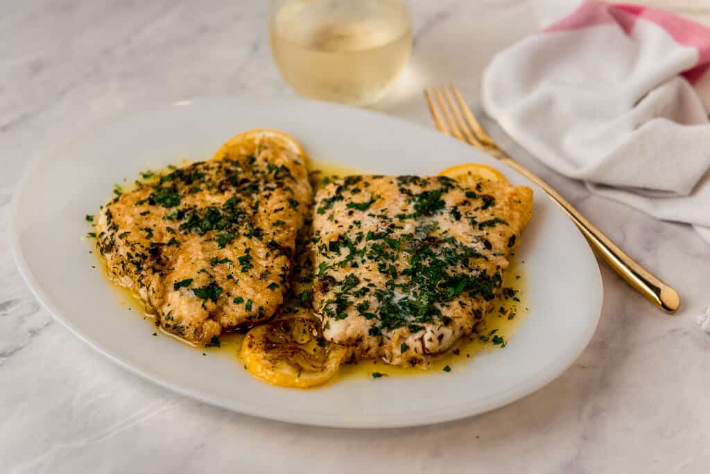 This simple lingcod recipe is perfect for an easy weeknight dinner and is done in nearly 15 minutes. Mild white fish is seared with butter, lemon juice and finished with fresh herbs.