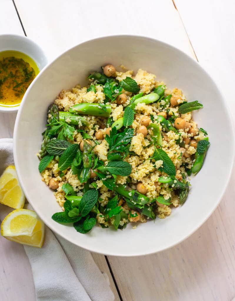 This simple and bright lemon couscous salad is tossed with tender asparagus, savory chickpeas, fresh herbs and a bright and lemony vinaigrette.