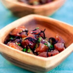 Shoyu poke is a popular poke style that you'll find all over the Hawaiian islands. This version is ahi shoyu poke with cubed ahi (tuna) that's seasoned with shoyu (soy sauce), sesame oil and sliced sweet onions.