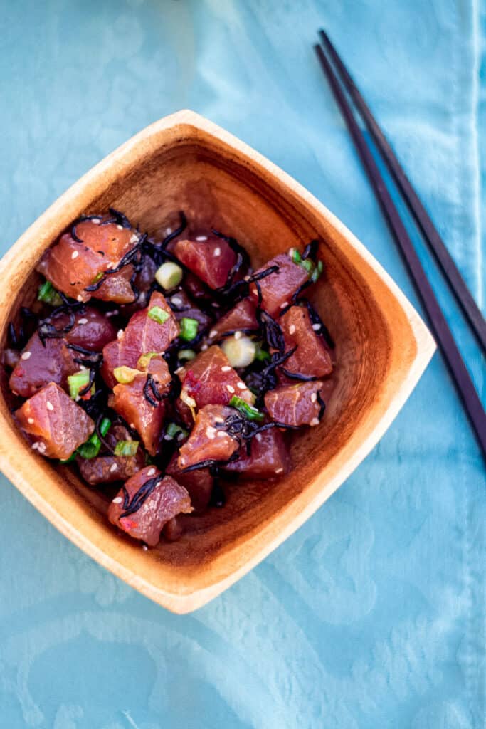 Shoyu poke is a popular poke style that you'll find all over the Hawaiian islands. This version is ahi shoyu poke with cubed ahi (tuna) that's seasoned with shoyu (soy sauce), sesame oil and sliced sweet onions. 