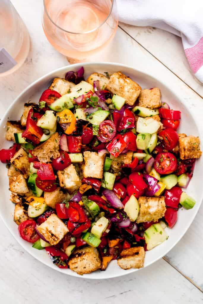 Grill summers produce and make this grilled panzanella salad dressed in a tangy vinaigrette, grilled vegetables and charred bread.