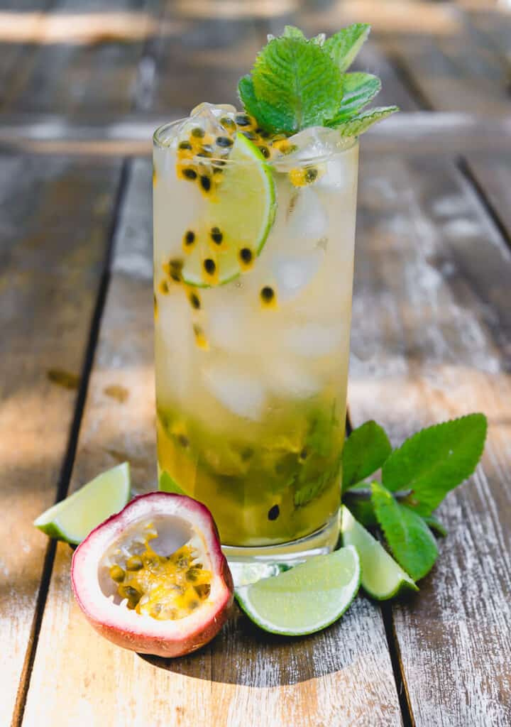 This passion fruit mojito is a muddled with classic flavors of mint and lime and finished with fragrant passion fruit pulp and garnished with more fresh mint.