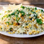 Easy lemon orzo salad is tossed with a simple lemon vinaigrette, grilled corn, creamy feta and lots of fresh basil.